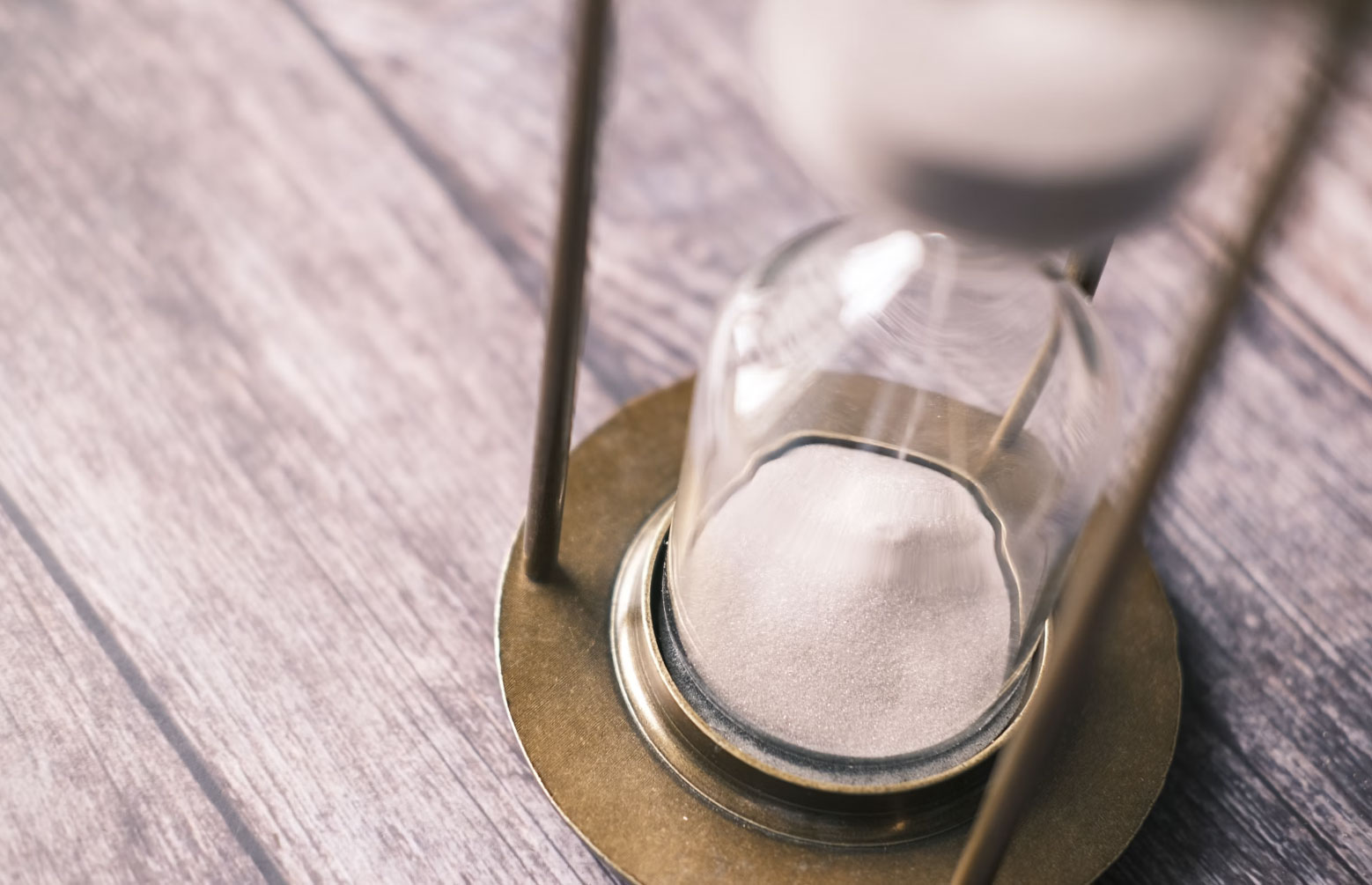 An Hourglass On A Wooden Table Symbolizes The Urgency Of Texas Property Tax Protest Deadlines